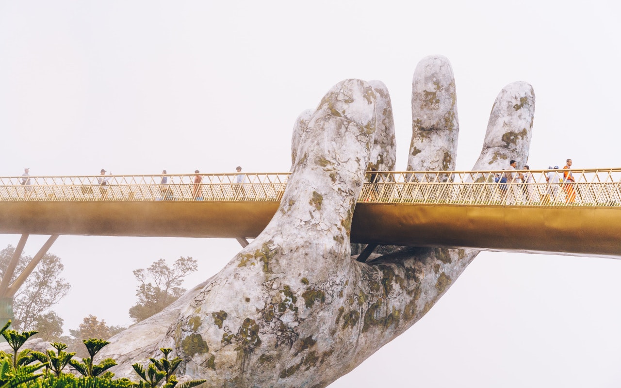 Hands holding bridge